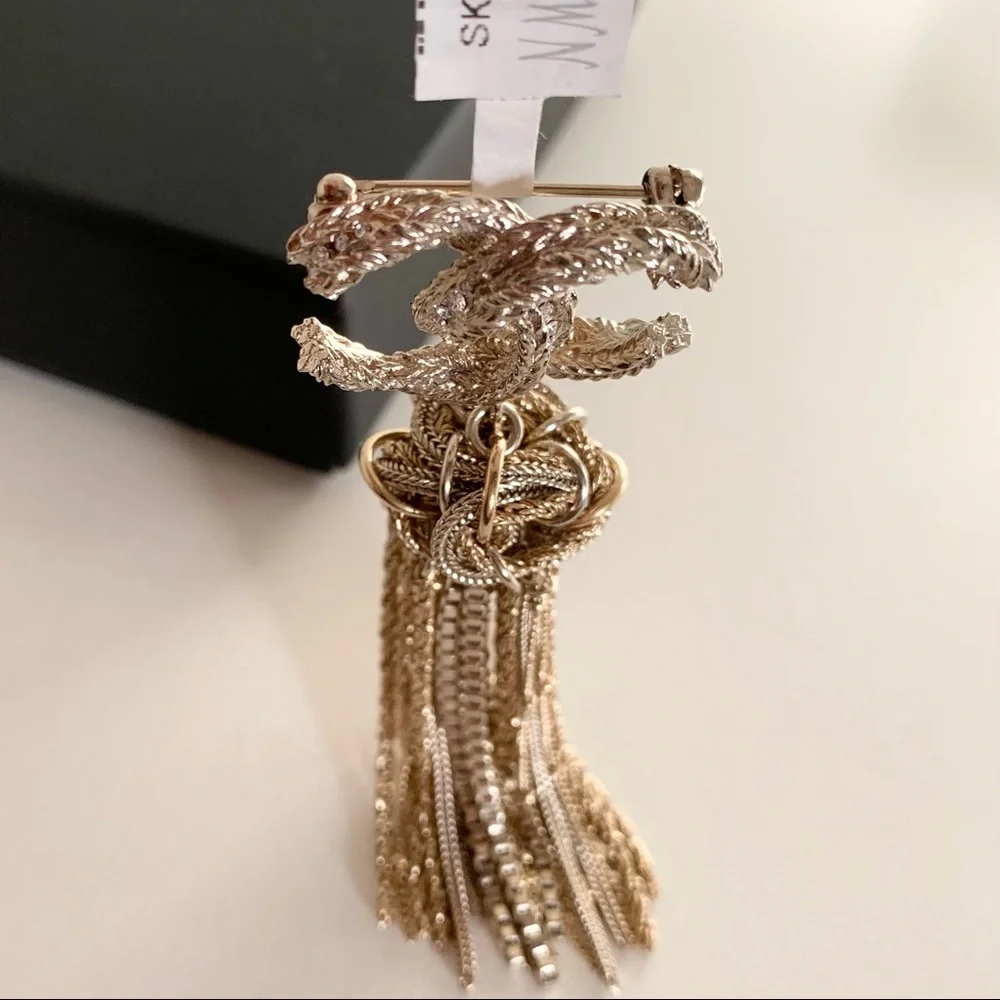 Chanel large tassel brooch in gold with crystals
